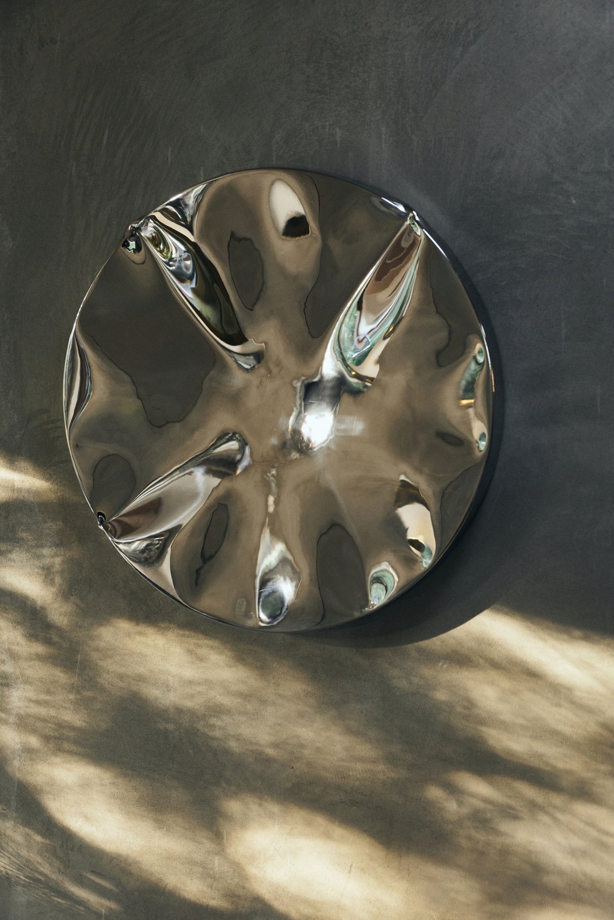 Dent wall sculpture chrome